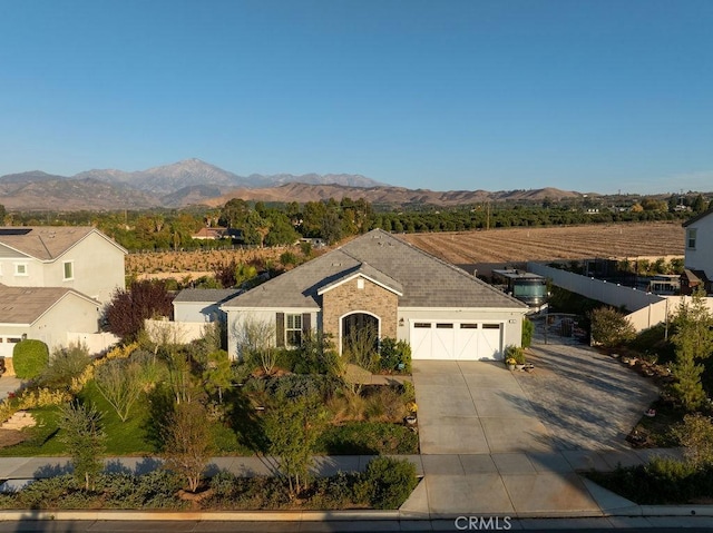 view of front of house featuring a mountain view and a garage