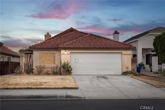 view of front of property with a garage