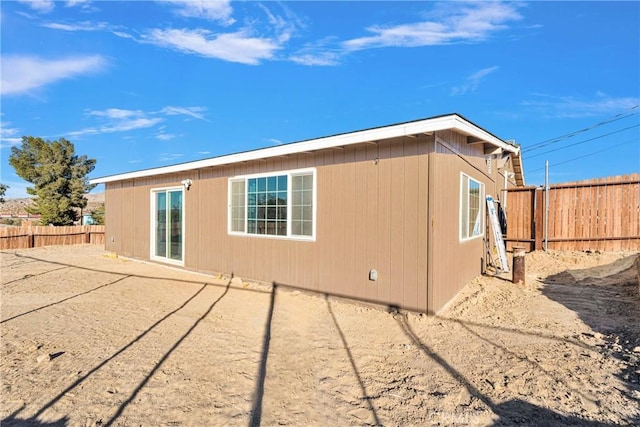 view of side of property with a fenced backyard