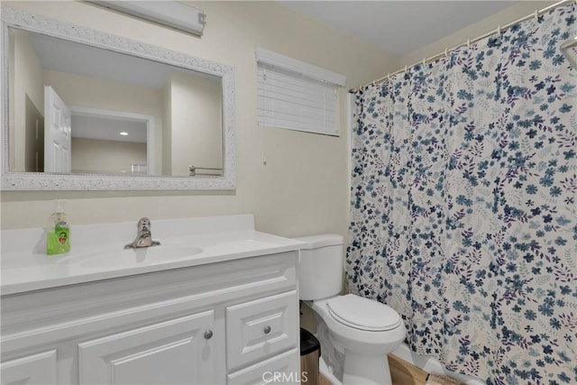 full bathroom featuring toilet and vanity