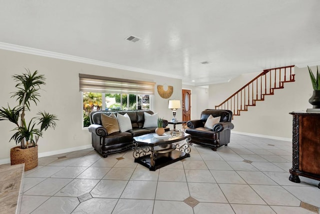 living room with ornamental molding and light tile patterned floors