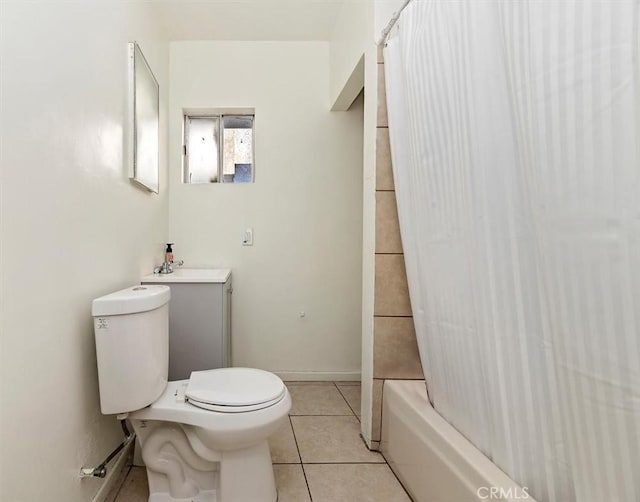 full bathroom with toilet, vanity, tile patterned floors, and shower / tub combo with curtain