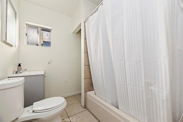 full bathroom with tile patterned floors, vanity, shower / tub combo, and toilet