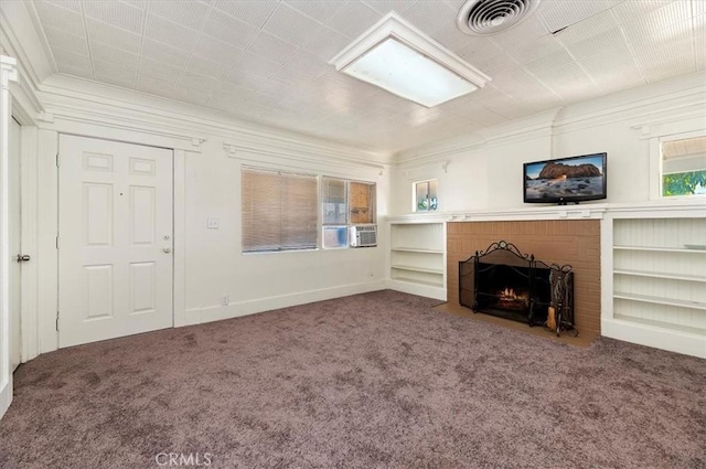 unfurnished living room featuring a fireplace, carpet floors, and ornamental molding