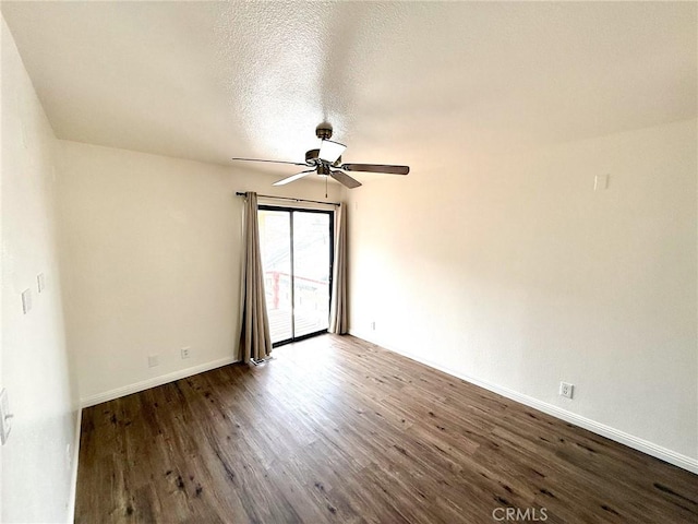 empty room with a textured ceiling, baseboards, a ceiling fan, and wood finished floors