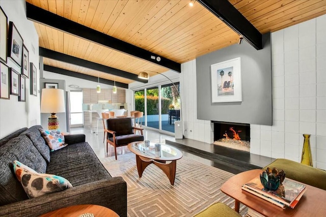 living room with wooden ceiling and vaulted ceiling with beams