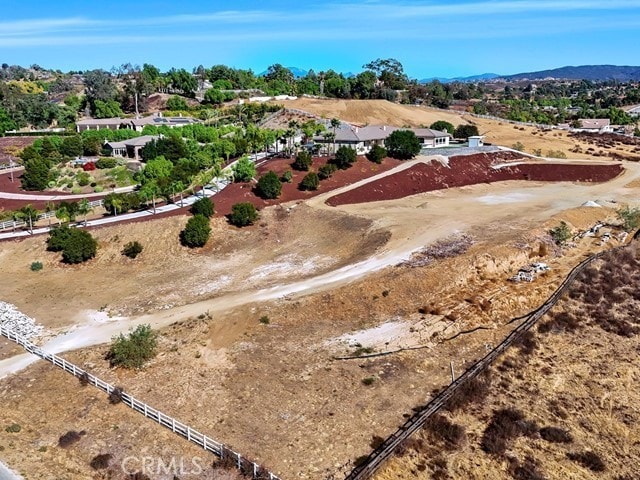 birds eye view of property featuring a mountain view