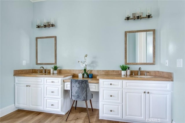 bathroom with hardwood / wood-style flooring and vanity