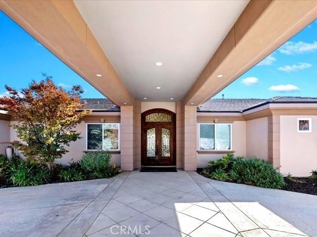 doorway to property featuring a patio