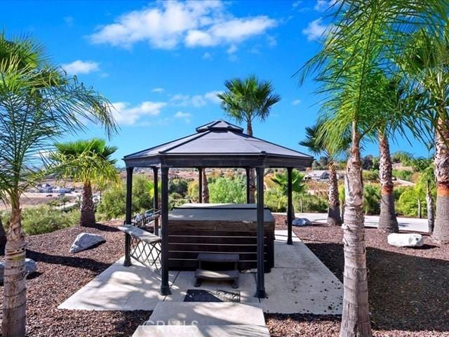 view of property's community with a gazebo and a jacuzzi