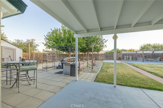 view of patio with a shed