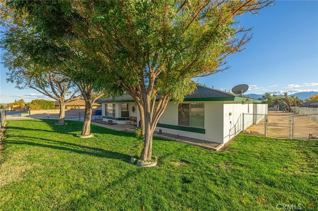 rear view of property with a yard