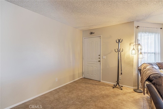 entrance foyer with a textured ceiling