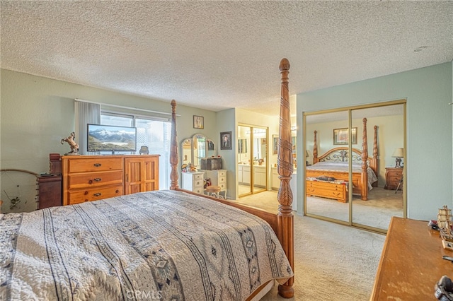 carpeted bedroom featuring a textured ceiling