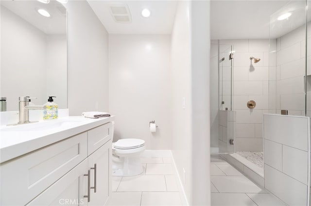 bathroom with tile patterned flooring, vanity, an enclosed shower, and toilet