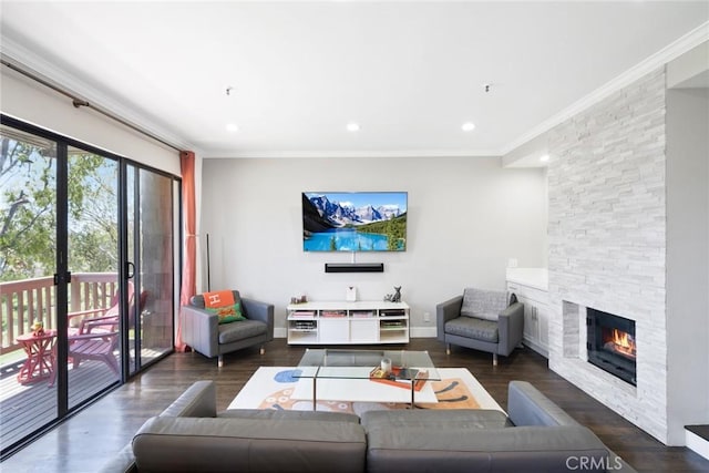 living room featuring a fireplace, dark hardwood / wood-style flooring, and ornamental molding