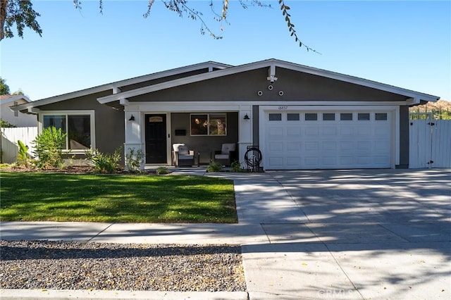 ranch-style home with a front lawn and a garage