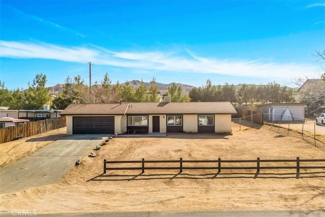 ranch-style house featuring a mountain view and a garage