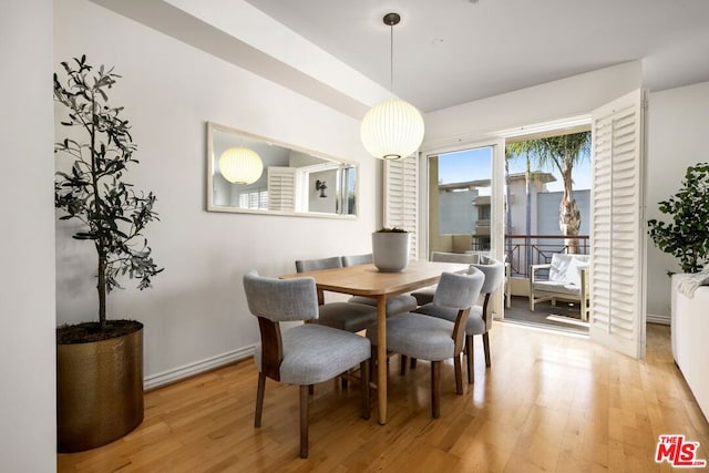 dining space featuring hardwood / wood-style flooring