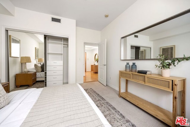 bedroom featuring a closet and carpet floors