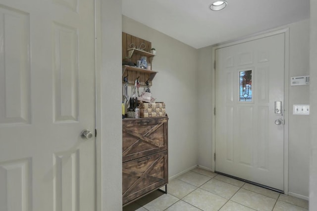 foyer featuring light tile patterned floors