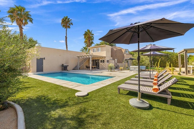 view of swimming pool with a lawn, a patio area, and a pergola