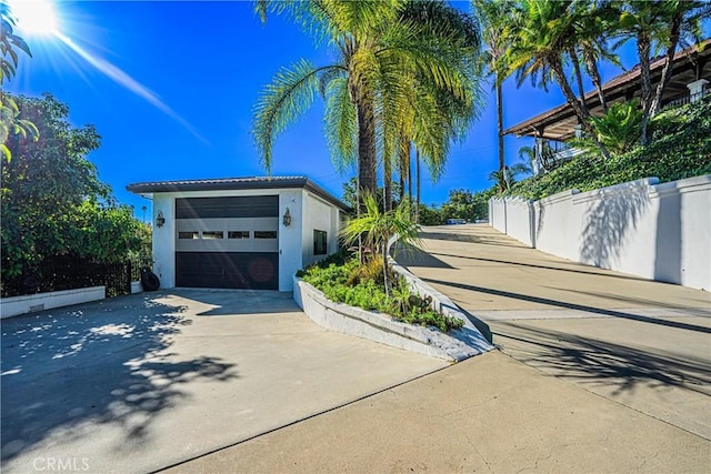 view of property exterior with a garage