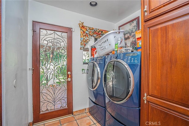 washroom with separate washer and dryer and light tile patterned flooring