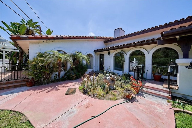 back of house featuring a patio