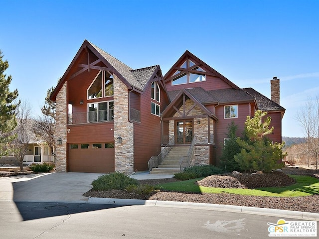 view of front of home featuring a balcony and a garage