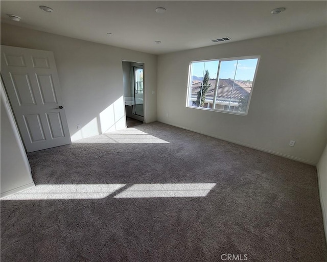 empty room with light colored carpet