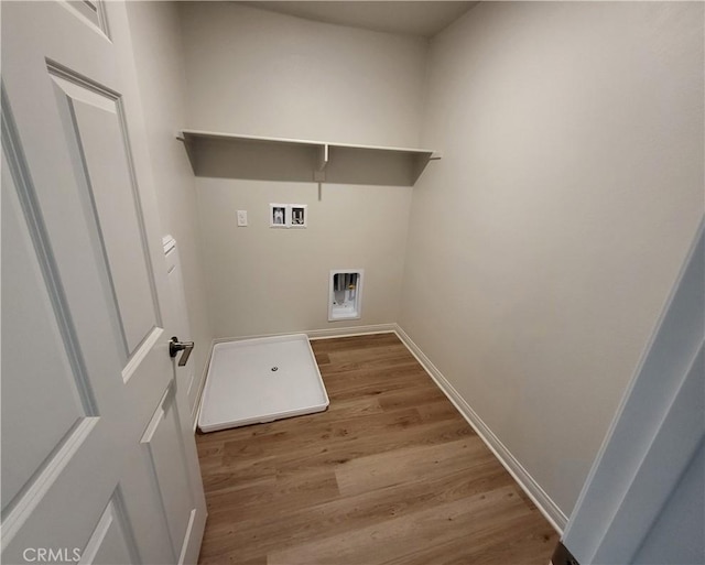 washroom with hookup for a washing machine and light hardwood / wood-style floors