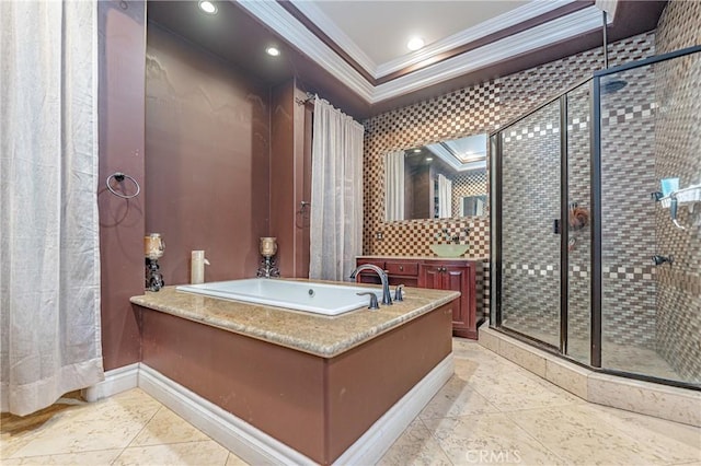 bathroom featuring ornamental molding and shower with separate bathtub