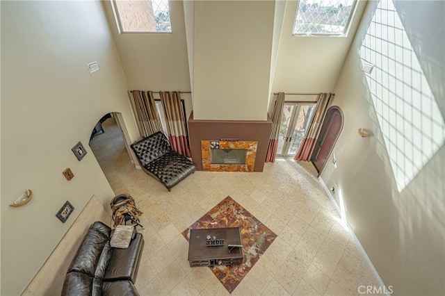 living room featuring a high ceiling