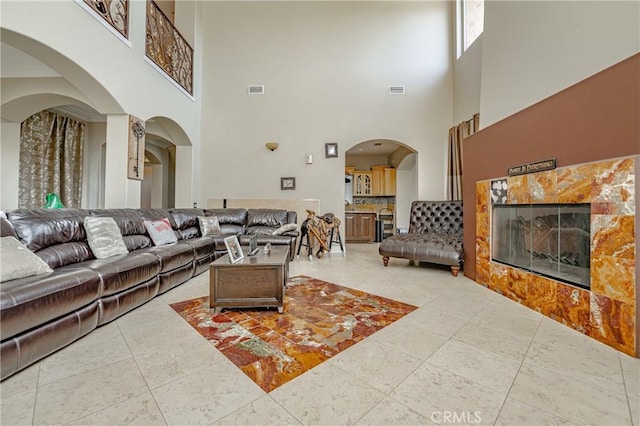 living room with a towering ceiling