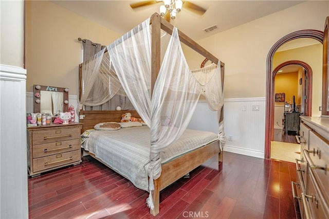 bedroom featuring ceiling fan and dark wood-type flooring