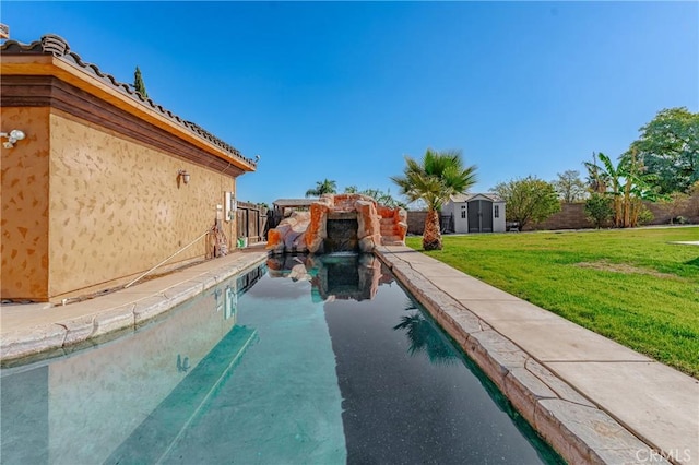 view of pool featuring a yard and a shed