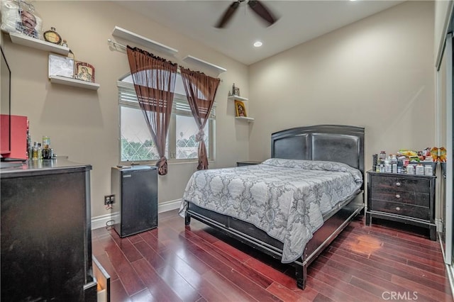 bedroom featuring ceiling fan and dark wood-type flooring