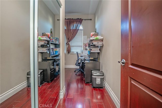 home office with dark hardwood / wood-style floors