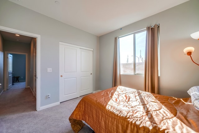 carpeted bedroom with a closet