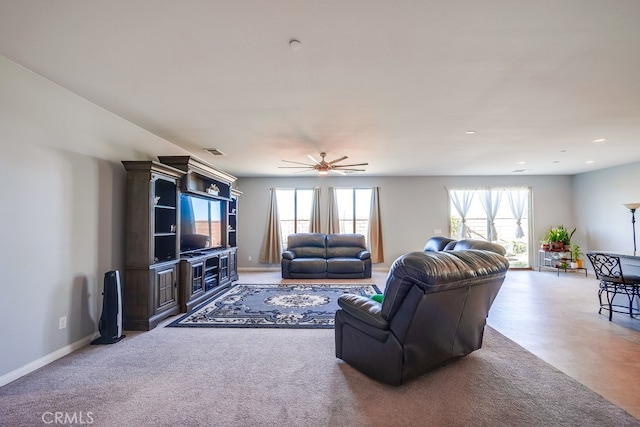 living room with plenty of natural light and ceiling fan