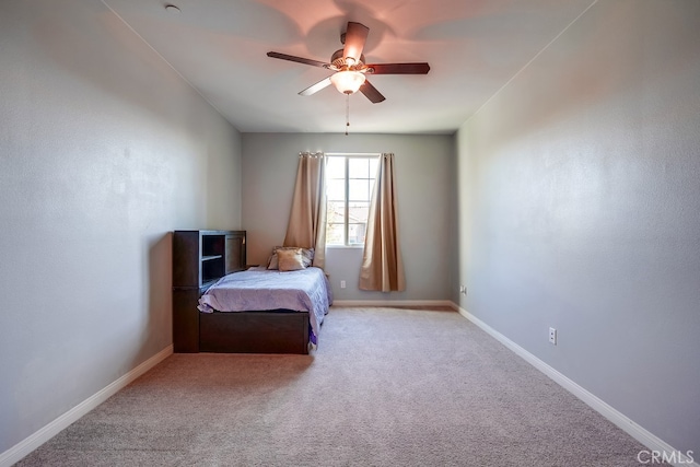 unfurnished bedroom featuring light colored carpet and ceiling fan