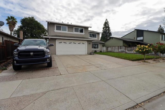 front of property with a garage and a front lawn