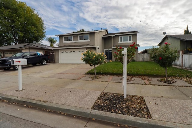 view of front of home featuring a garage and a front yard