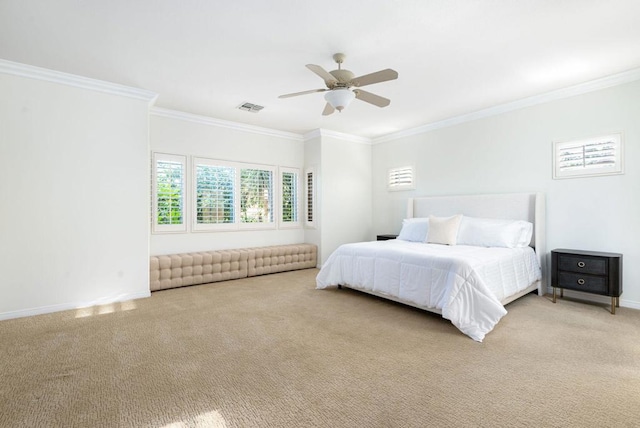 bedroom with ceiling fan, carpet, and ornamental molding