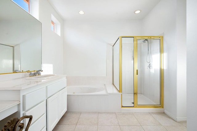 bathroom with tile patterned flooring, vanity, and separate shower and tub