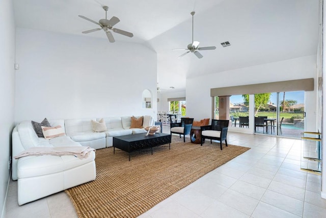 living room with high vaulted ceiling, ceiling fan, and light tile patterned flooring