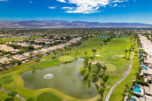 birds eye view of property featuring a water and mountain view