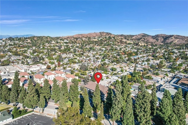 birds eye view of property with a residential view and a mountain view