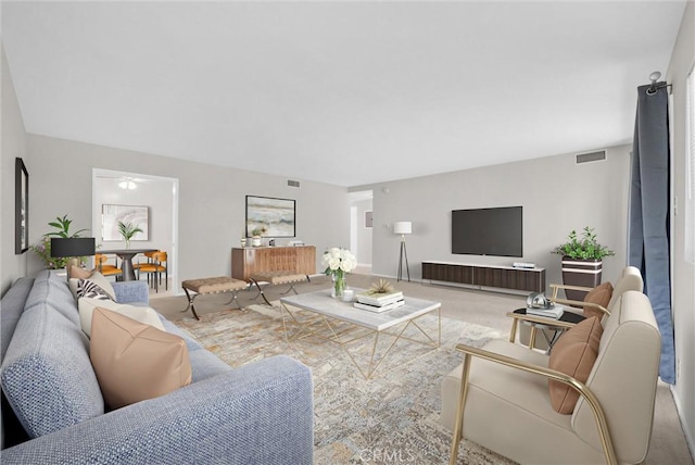 carpeted living room featuring visible vents